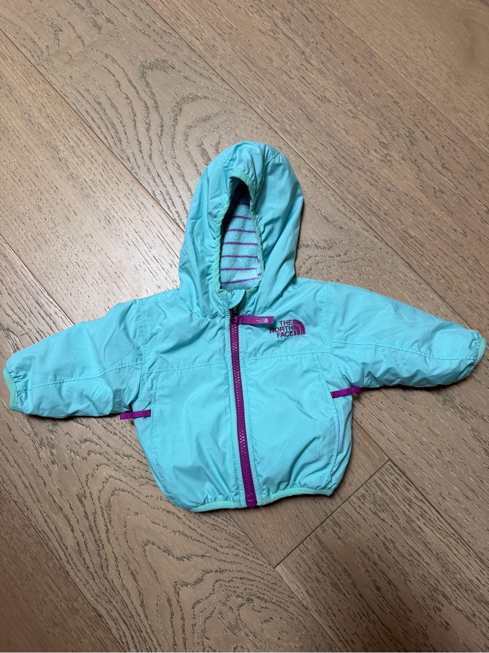 The North Face Turquoise Hooded Infant Jacket with Purple Accents